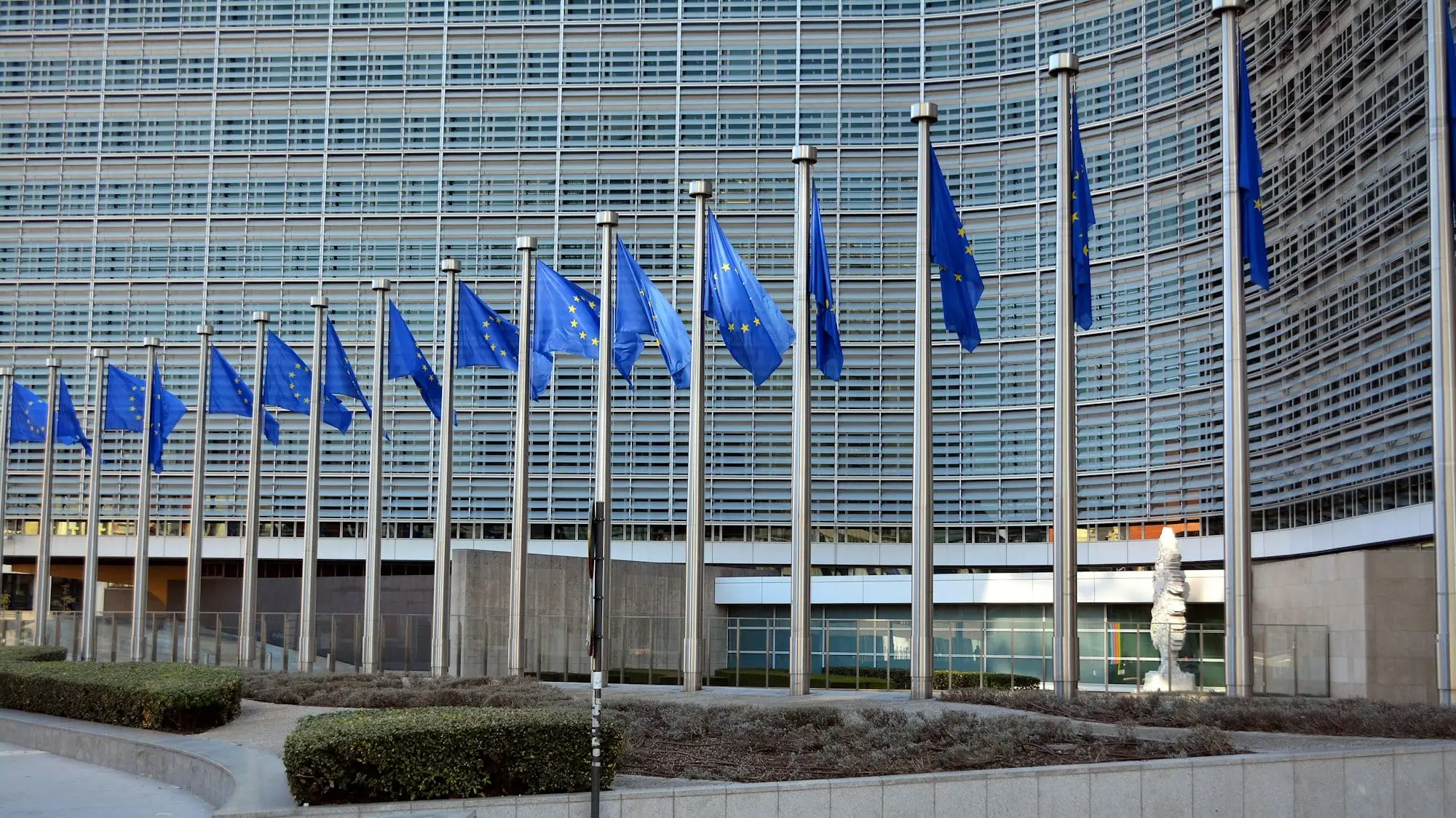 European Union flags flying outside the Berlaymont, the European Commission building in Brussels